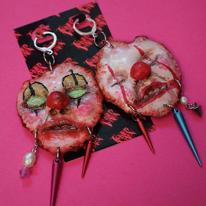 skinned face clown earrings