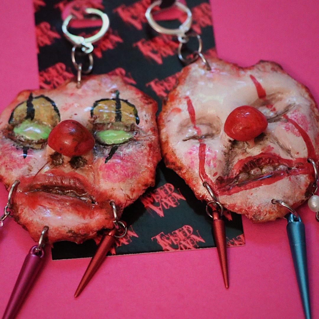 skinned face clown earrings