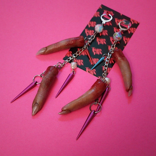 died in the 90s severed finger earrings